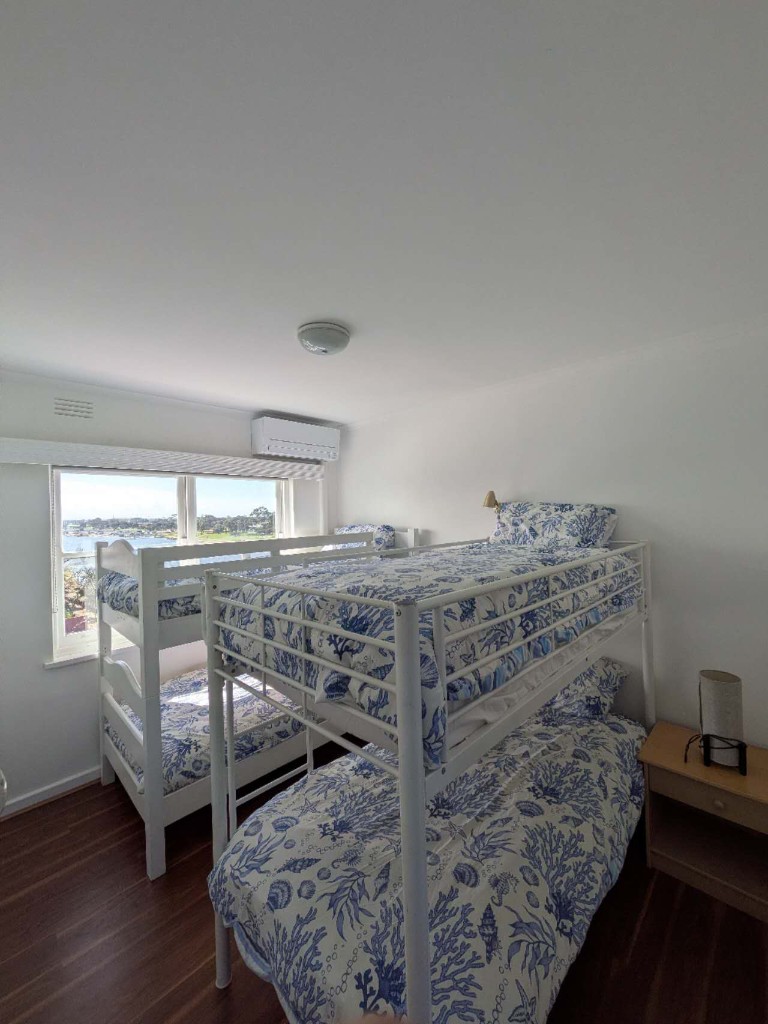 The Lookout Bunks with twin bunk beds and a river outlook